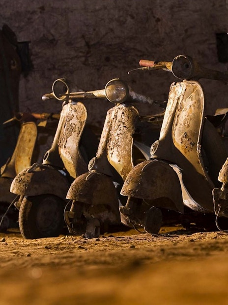 Vintage scooters in the Bourbon Tunnel, Naples guided tour.