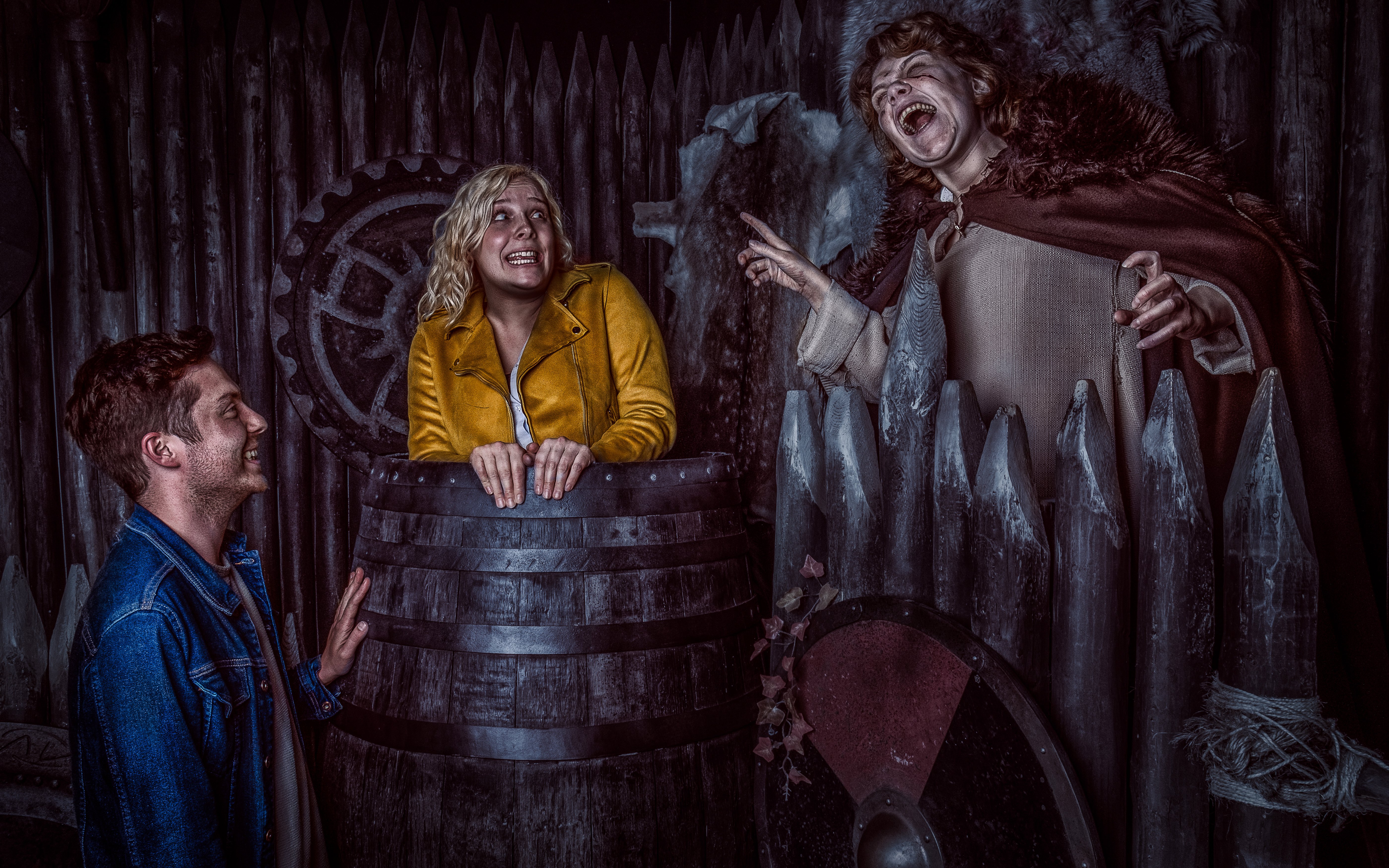 Visitors interact with actors in Viking-themed setting at York Dungeon.