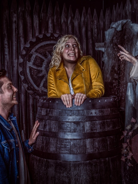 Visitors interact with actors in Viking-themed setting at York Dungeon.