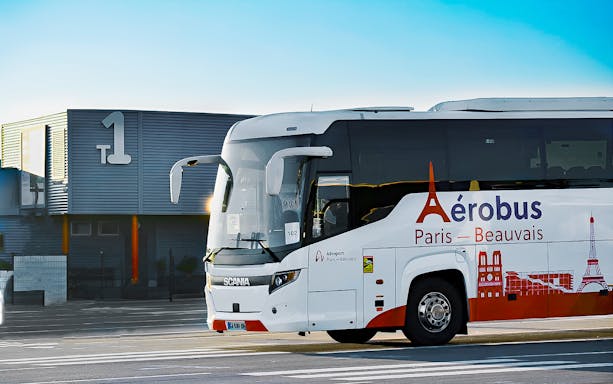 Shuttle bus at Beauvais Airport offering round-trip service to Paris.