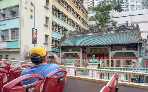 Guest photographing Man Mo Temple from Big Bus tour in Hong Kong.
