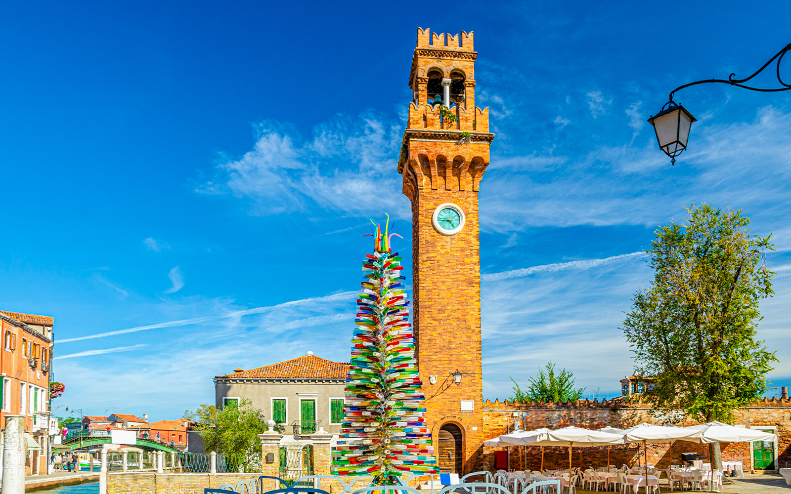Murano glass Christmas tree and clock tower in Venice, Italy.