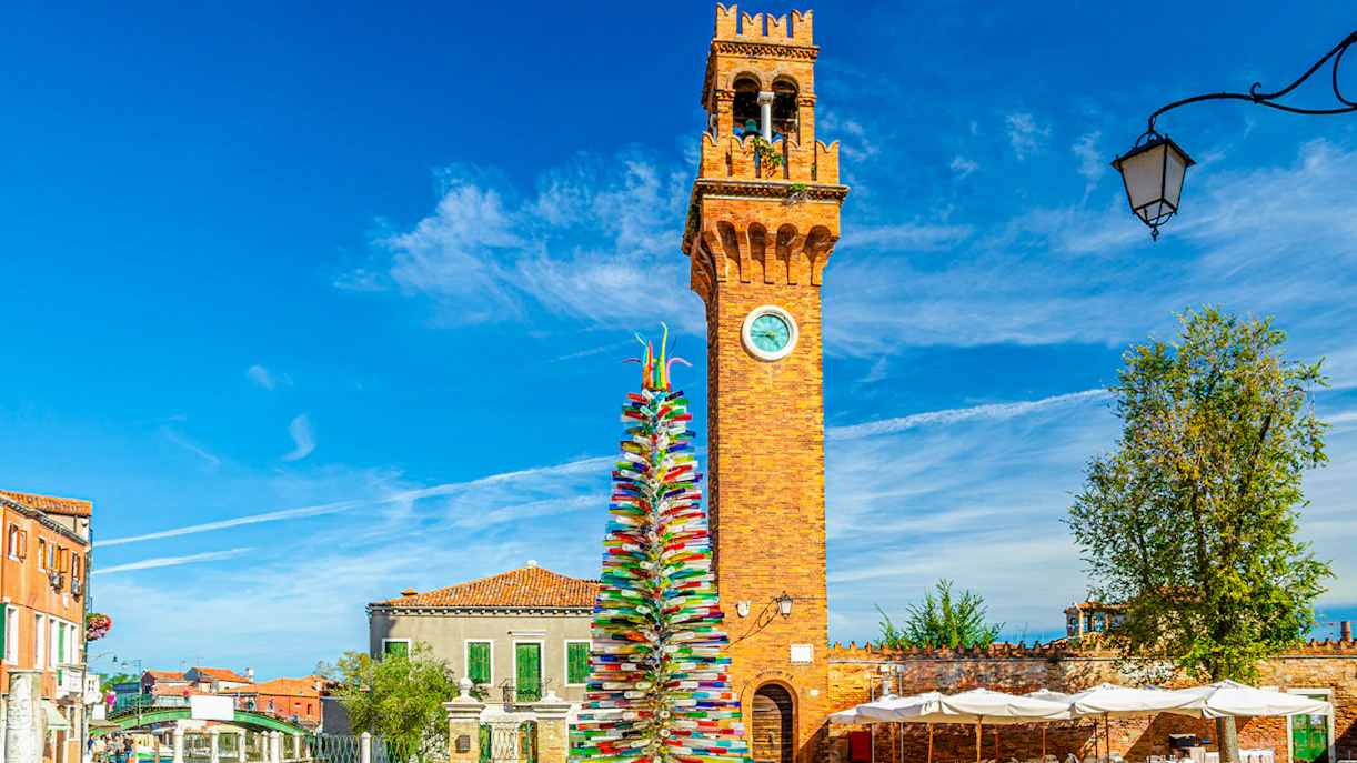 Murano glass Christmas tree and clock tower in Venice, Italy.
