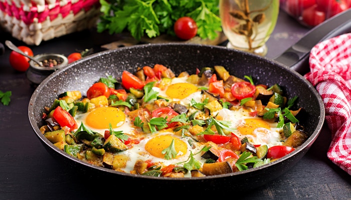 Shakshuka dish with poached eggs in tomato sauce, Arabic cuisine.