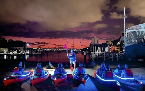 Kayakers preparing for sunrise paddle on Sydney Harbour.