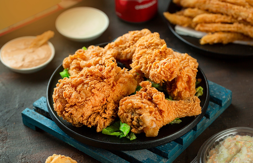 Fried chicken combos with sides at a New York City food tour.