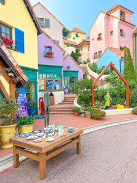 Colorful buildings and art installations at Petite France, Seoul to Nami Island tour.