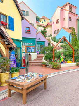Colorful buildings and art installations at Petite France, Seoul to Nami Island tour.