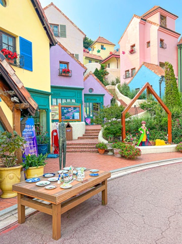 Colorful buildings and art installations at Petite France, Seoul to Nami Island tour.