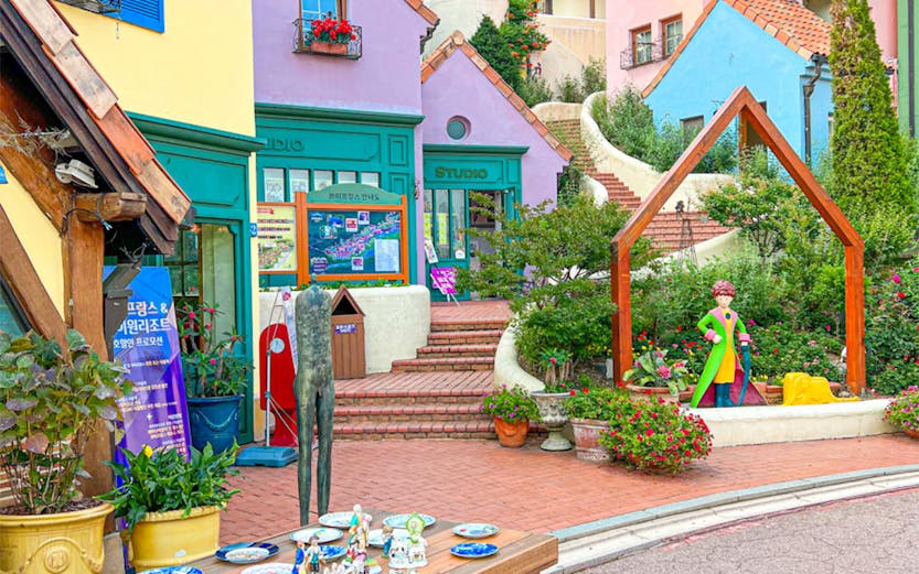 Colorful buildings and art installations at Petite France, Seoul to Nami Island tour.