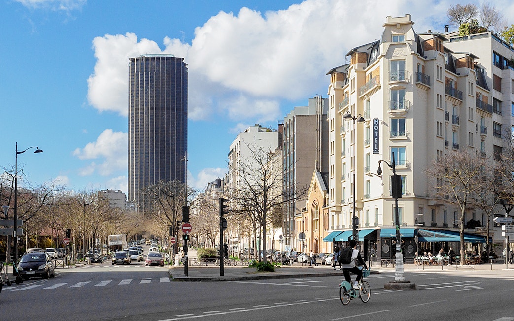 Montparnasse Tower and street view during walking tour in Paris.