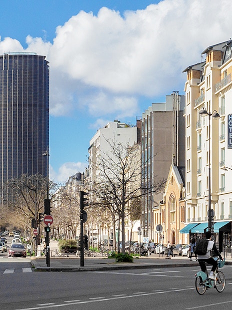 Montparnasse Tower and street view during walking tour in Paris.