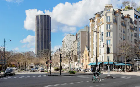 Montparnasse Tower and street view during walking tour in Paris.
