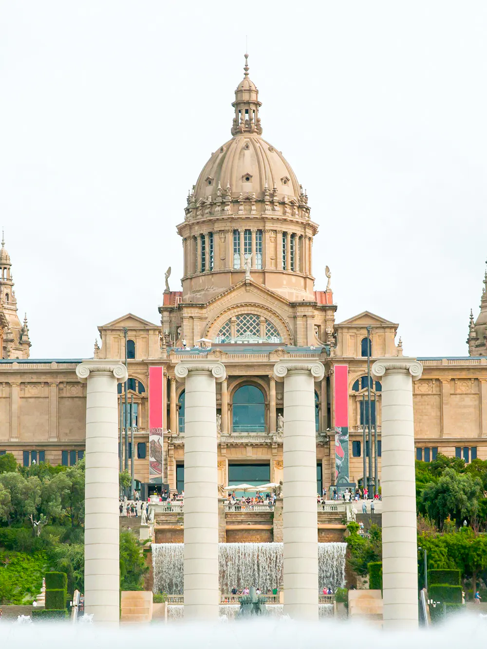 National Art Museum of Catalonia exterior with visitors in Barcelona, Spain.
