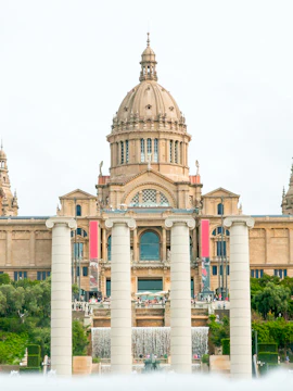 National Art Museum of Catalonia exterior with visitors in Barcelona, Spain.