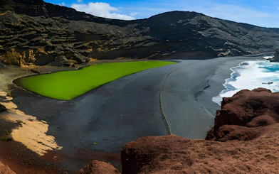 Aerial view of El Golfo's green lagoon and black sand beach, Lanzarote.