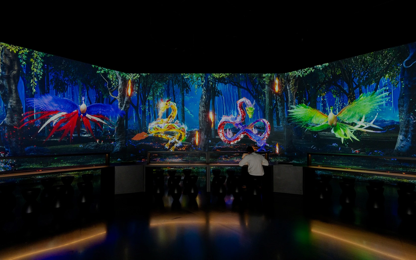 Interactive digital art display with colorful creatures at Arte Museum, New York.