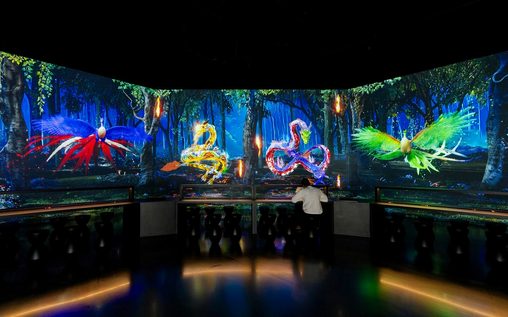 Interactive digital art display with colorful creatures at Arte Museum, New York.