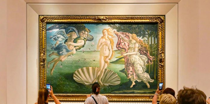 Tourists viewing Botticelli's "The Birth of Venus" at Uffizi Gallery, Florence.