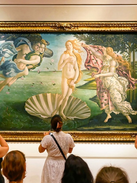 Tourists viewing Botticelli's "The Birth of Venus" at Uffizi Gallery, Florence.