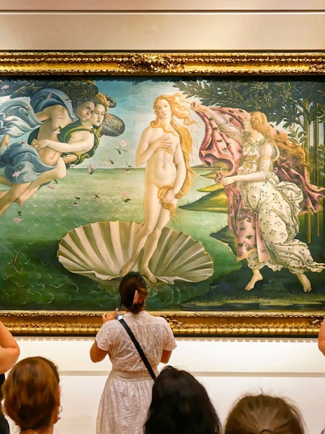 Tourists viewing Botticelli's "The Birth of Venus" at Uffizi Gallery, Florence.