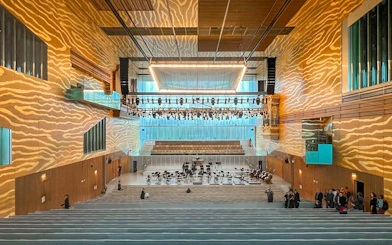 Interior of Casa de la Música concert hall in Porto, featuring stage and seating area.