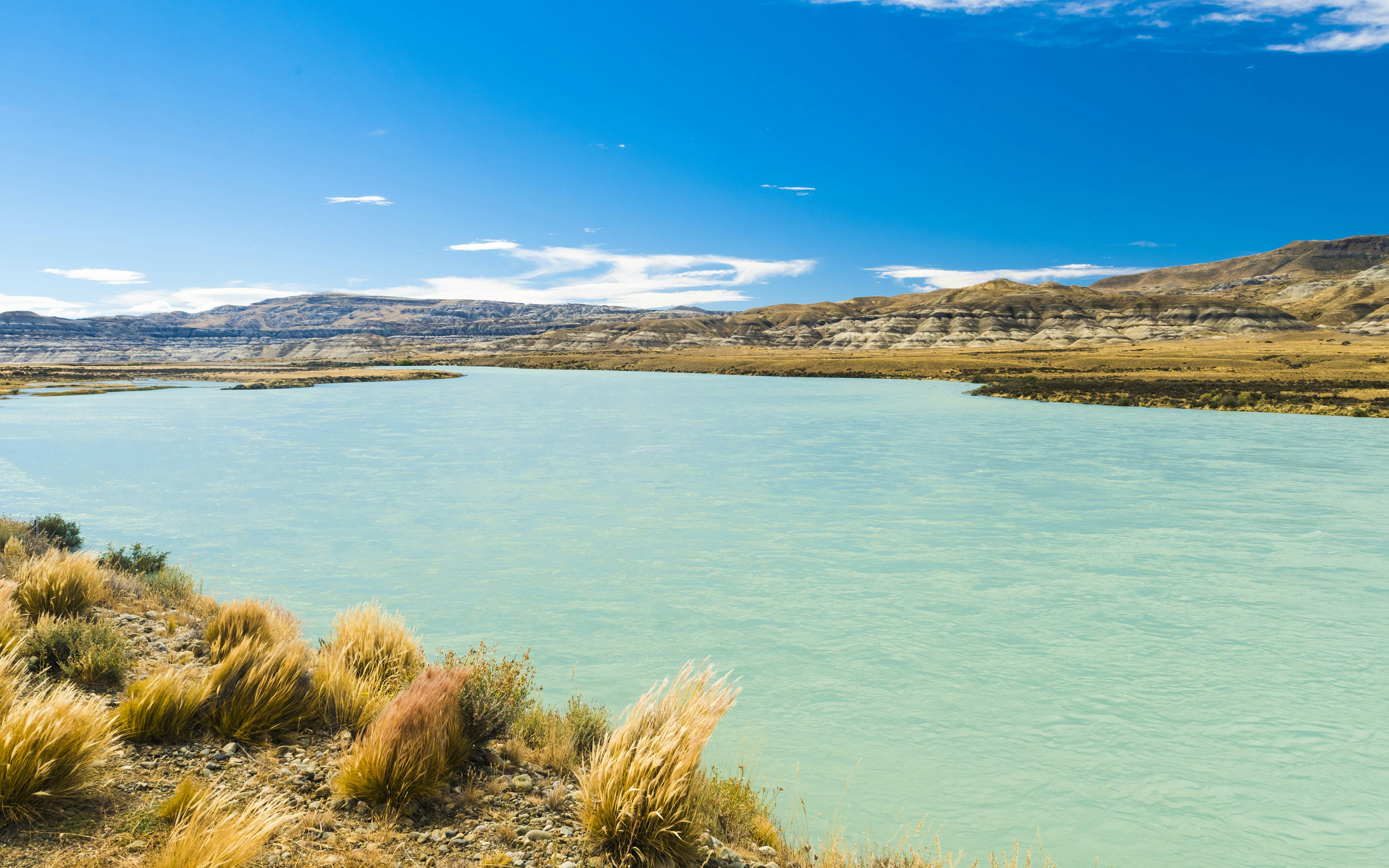 Hills along the turquoise La Leona River in Argentina, viewed from El Calafate to El Chaltén.