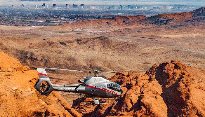 Maverick helicopter flying over Red Rock Canyon near Las Vegas.