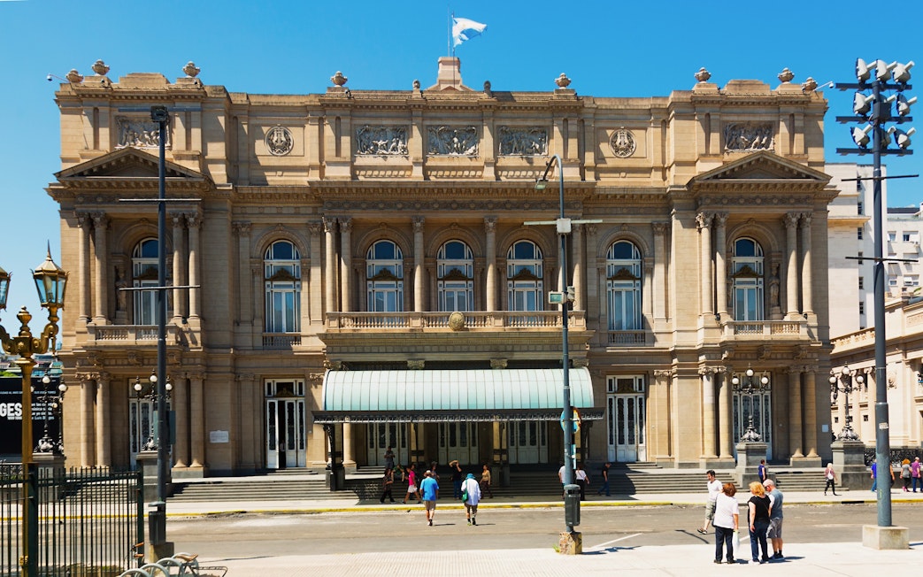 Tourists standing outside Teatro Colón in Buenos Aires, Argentina.
