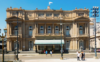 Tourists standing outside Teatro Colón in Buenos Aires, Argentina.