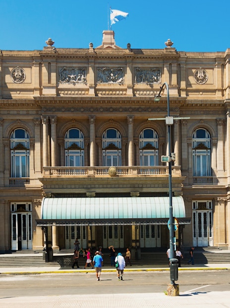 Tourists standing outside Teatro Colón in Buenos Aires, Argentina.