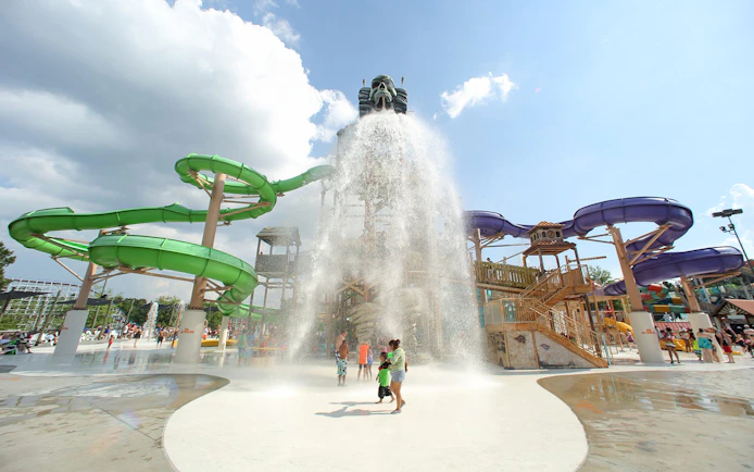 Water park with green and purple slides at Six Flags Over Georgia.