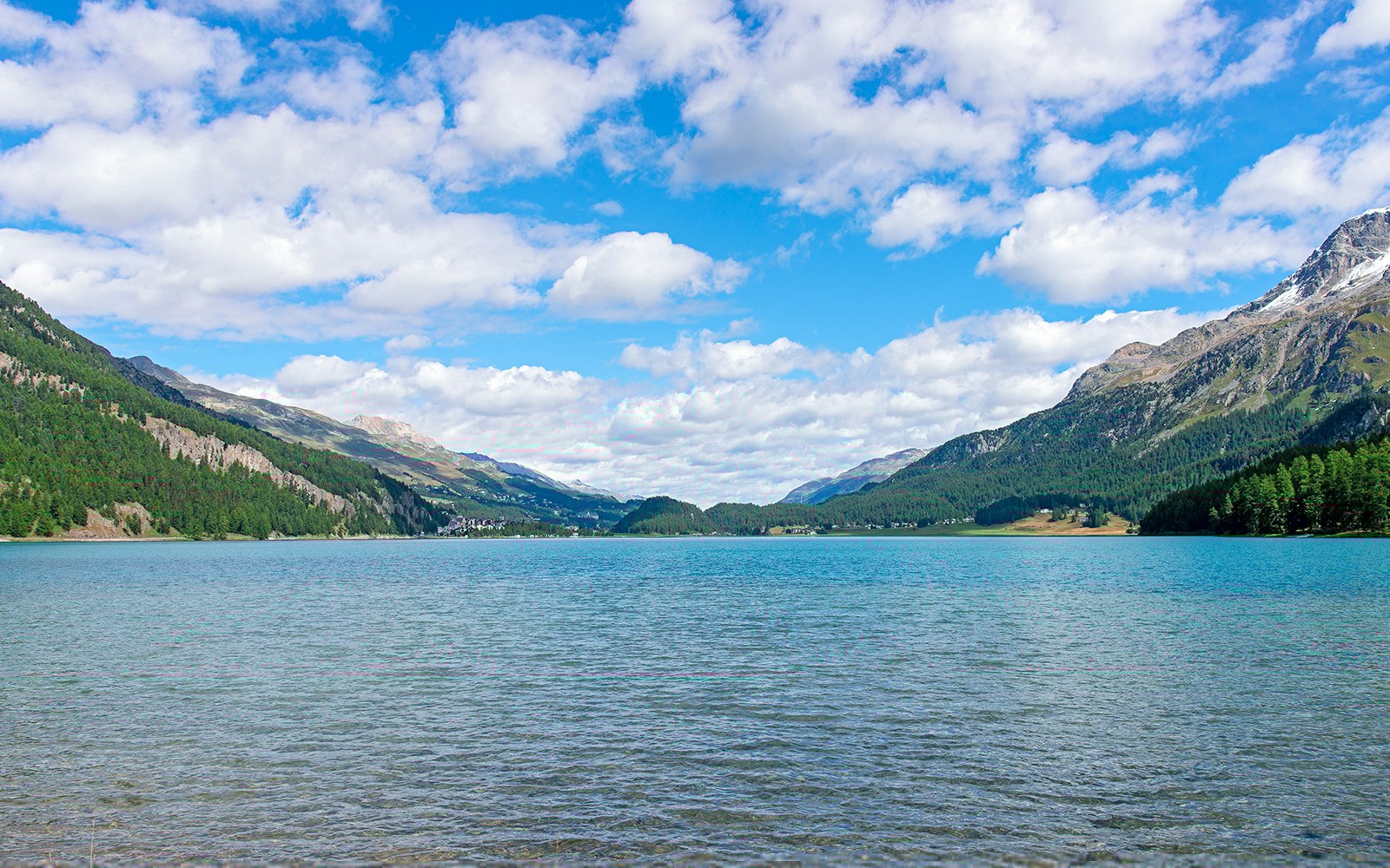 The village of Silvaplana is nestled in the wide lake plateau of the Upper Engadine.