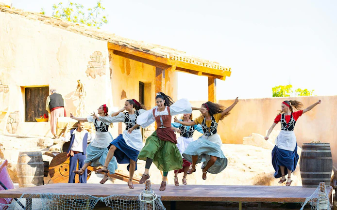 Dancers performing traditional Spanish dance at Terra Mitica theme park, Spain.