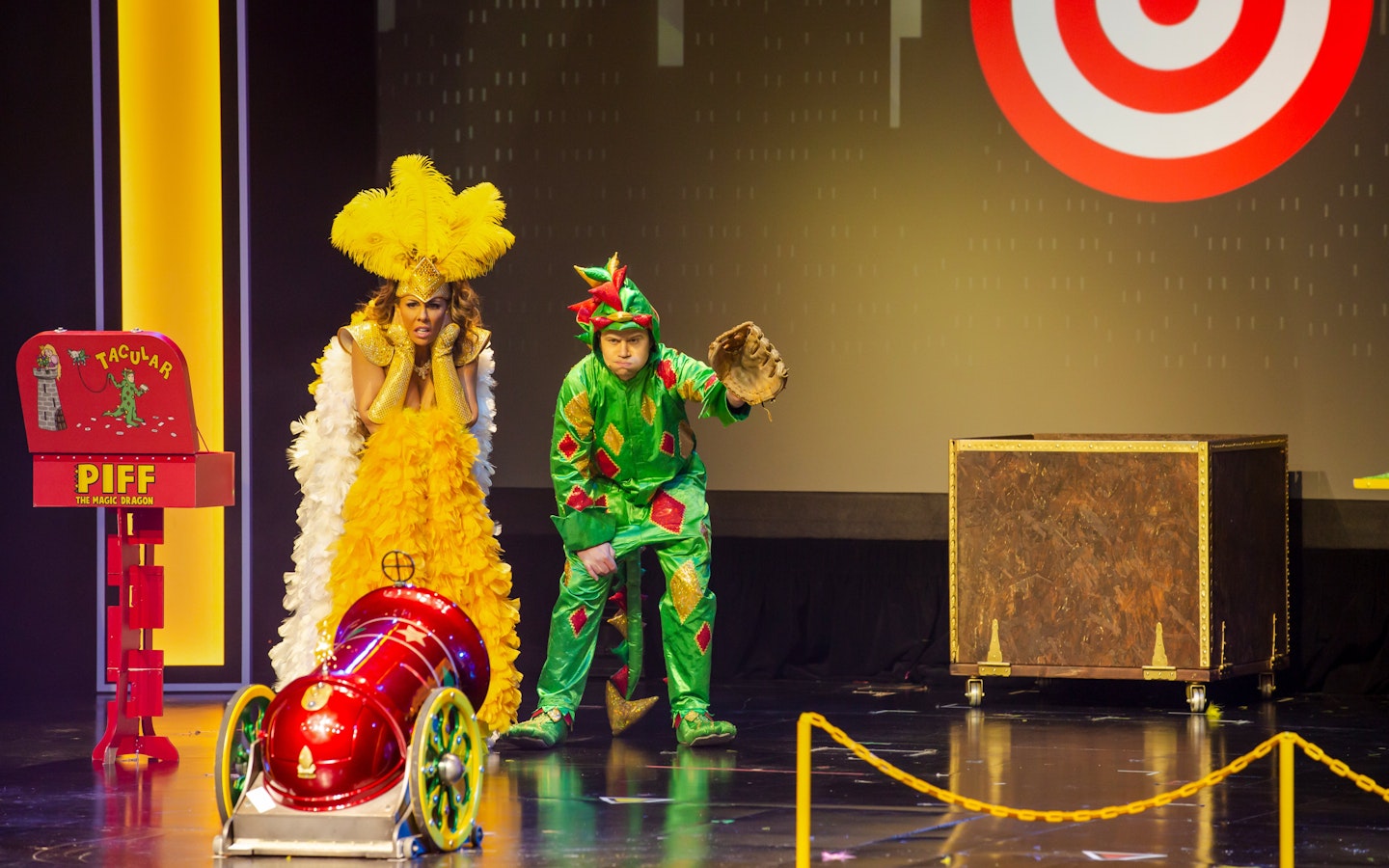 Piff the Magic Dragon stage performance in Vegas with colorful costumes and props.