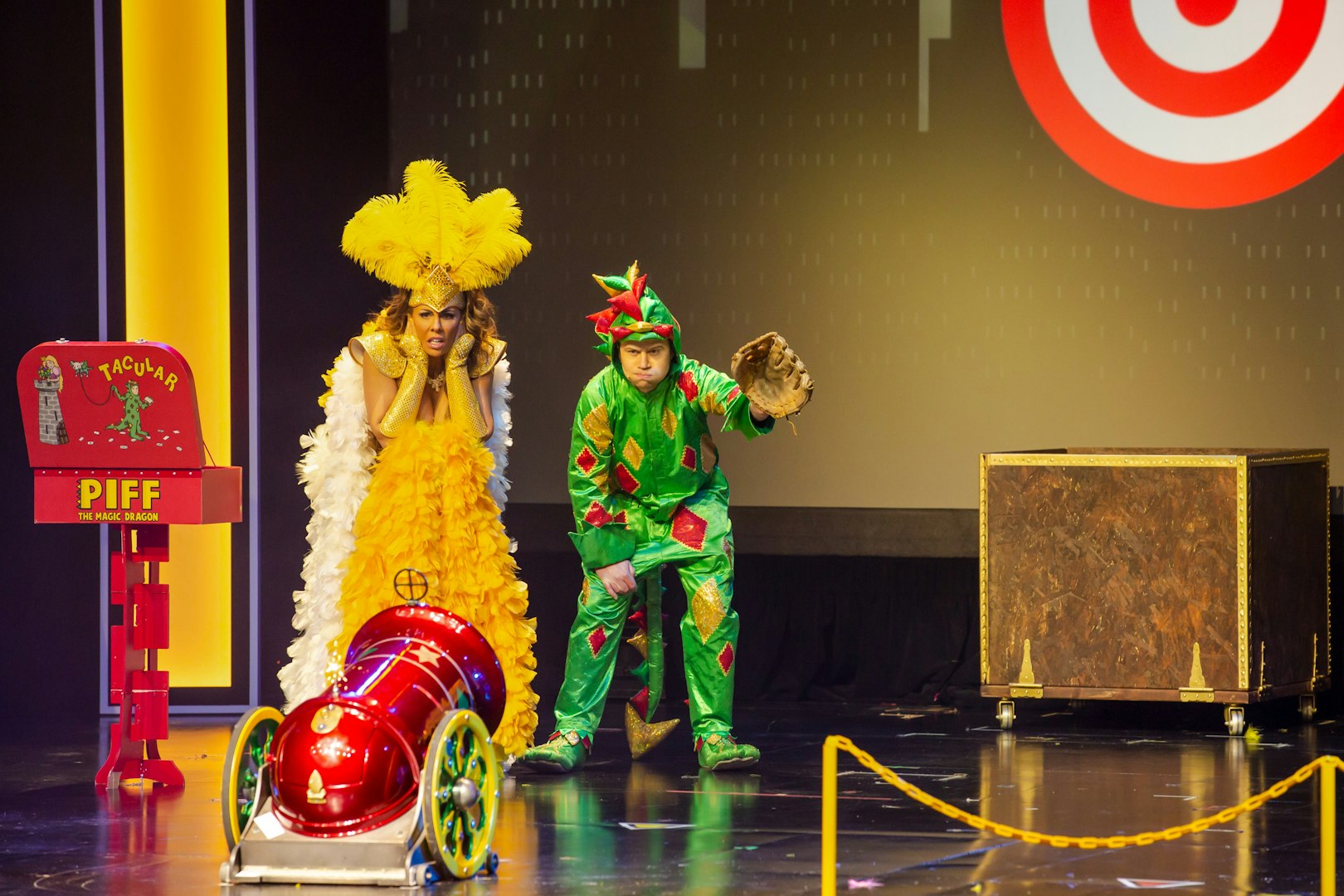 Piff the Magic Dragon stage performance in Vegas with colorful costumes and props.