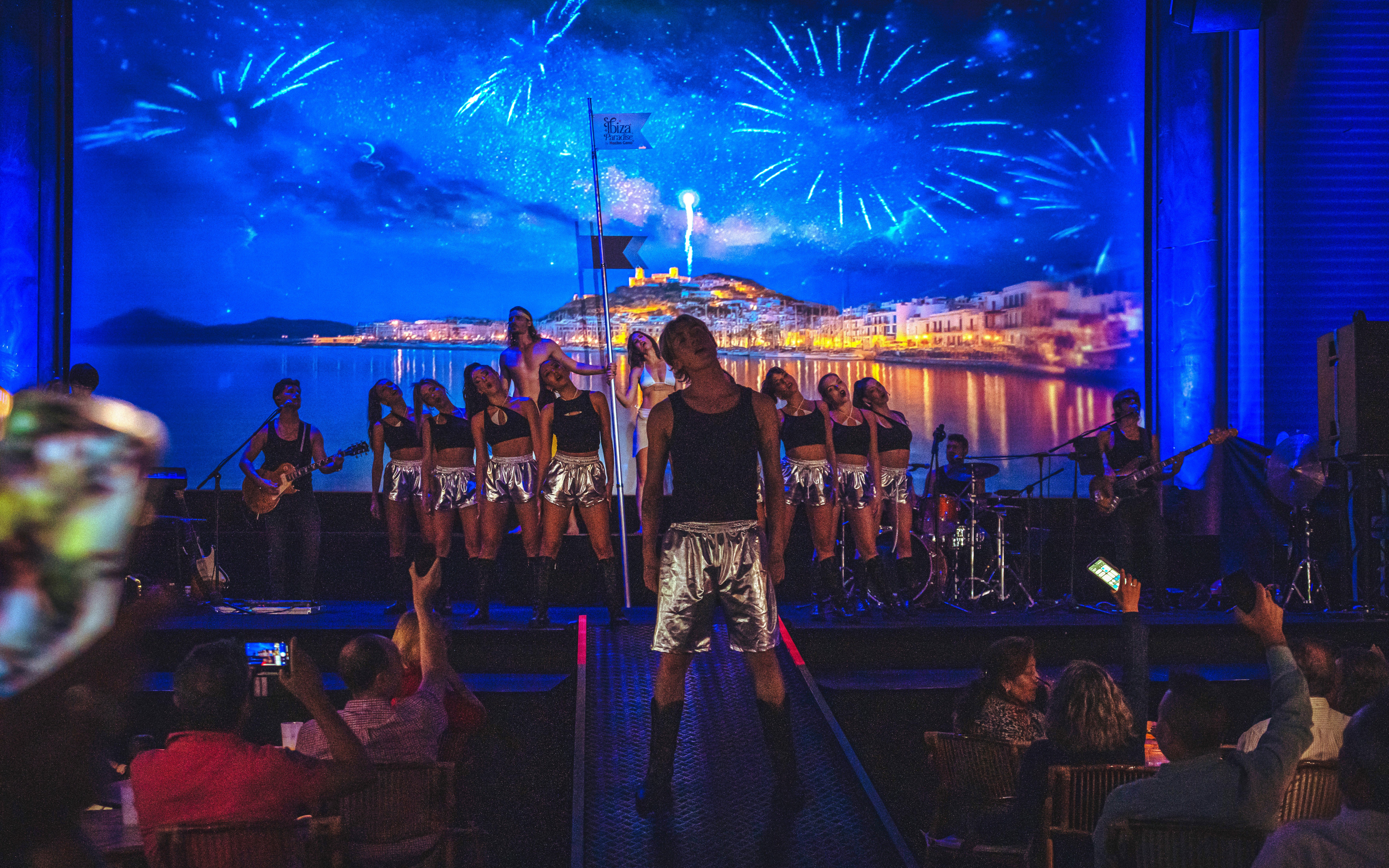 Stage performance at Ibiza Paradise by Nacho Cano, Madrid show with dancers and musicians.