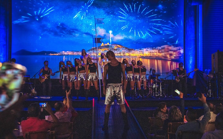 Stage performance at Ibiza Paradise by Nacho Cano, Madrid show with dancers and musicians.