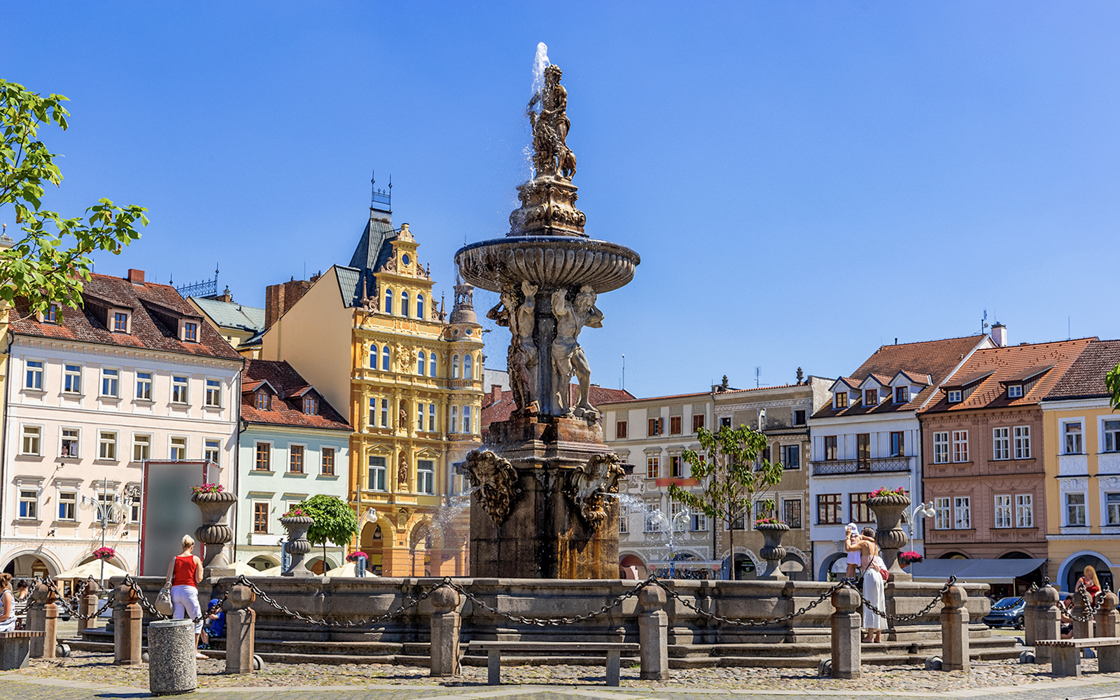 Samson fighting lion fountain and bell tower in main square, Ceske Budejovice.