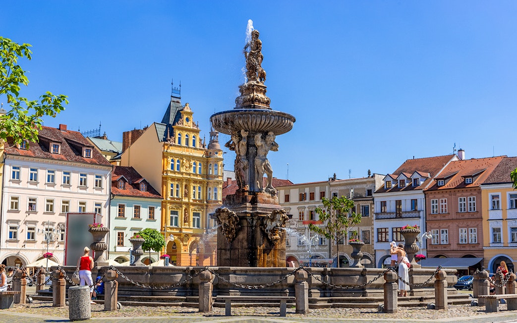 Samson fighting lion fountain and bell tower in main square, Ceske Budejovice.