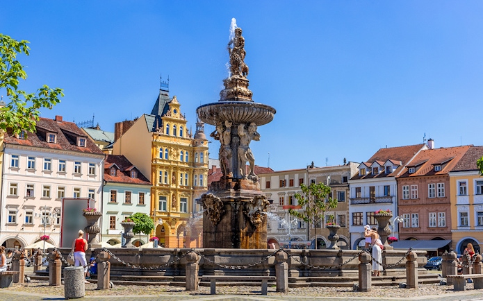Samson fighting lion fountain and bell tower in main square, Ceske Budejovice.