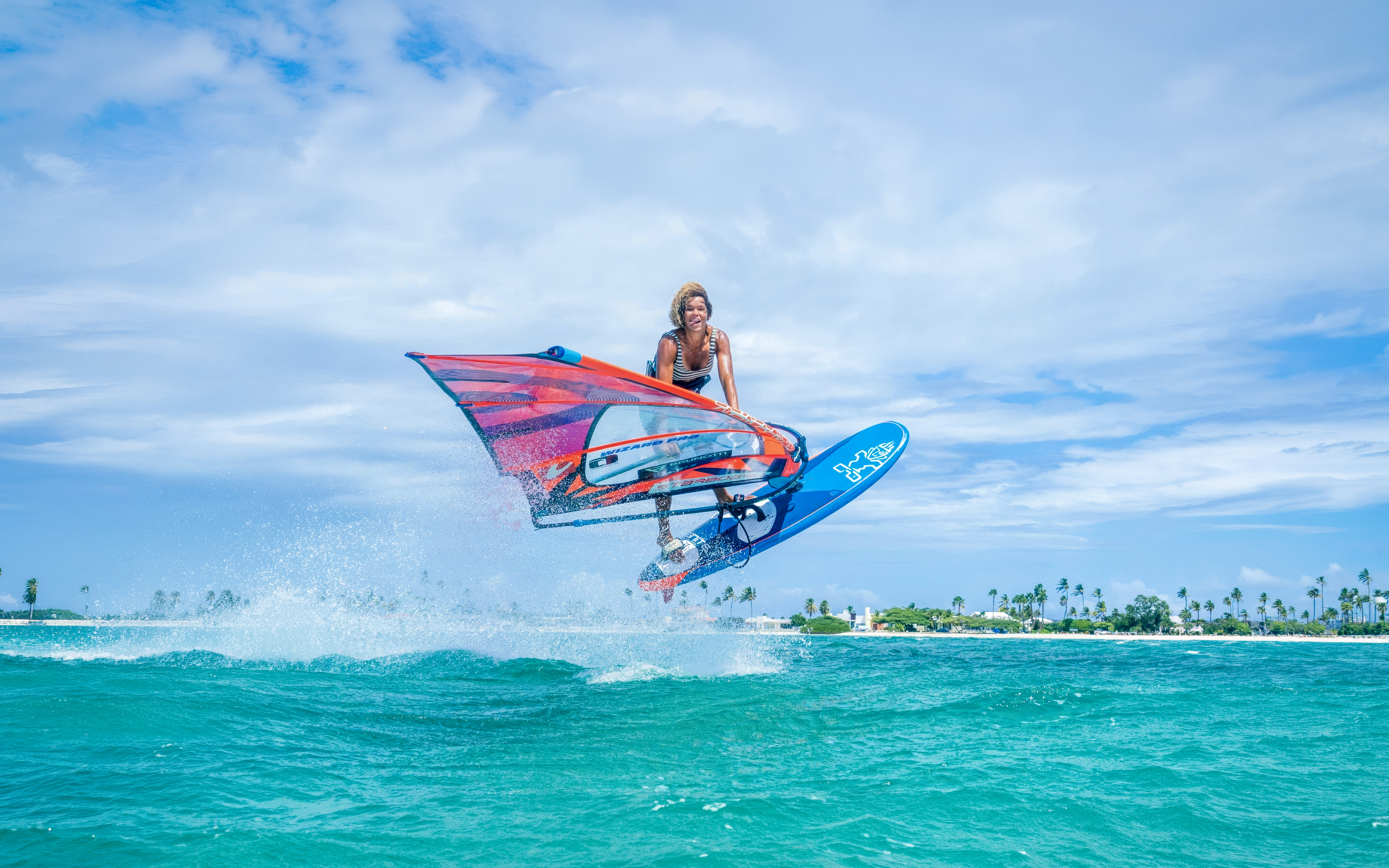 Windsurfer jumping over waves in Delta Neretva, Croatia.