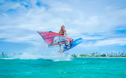 Windsurfer jumping over waves in Delta Neretva, Croatia.