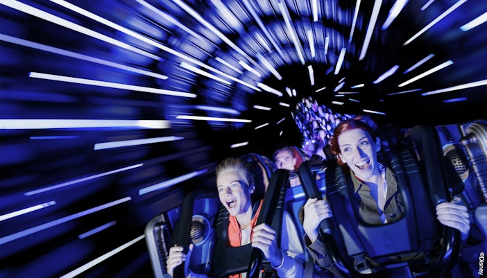 People enjoying the Hyperspace Mountain ride at Disneyland Paris.