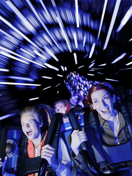People enjoying the Hyperspace Mountain ride at Disneyland Paris.