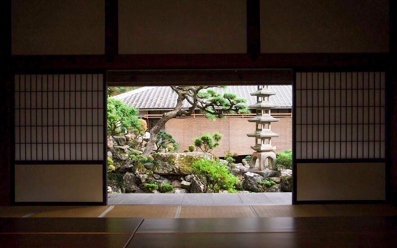 Kosho-ji Temple interior with people practicing Zazen meditation, Kyoto, Japan.