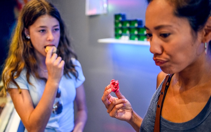 Tasting macarons on the Secret Food Tour near Notre Dame, Paris.