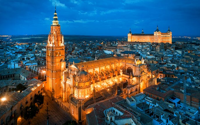 Aerial view of Toledo Cathedral illuminated at night, Spain.