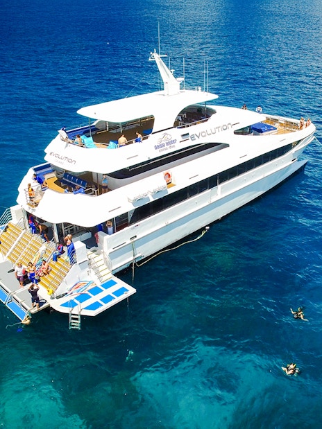 Cruise ship with snorkelers near Great Barrier Reef, Australia.