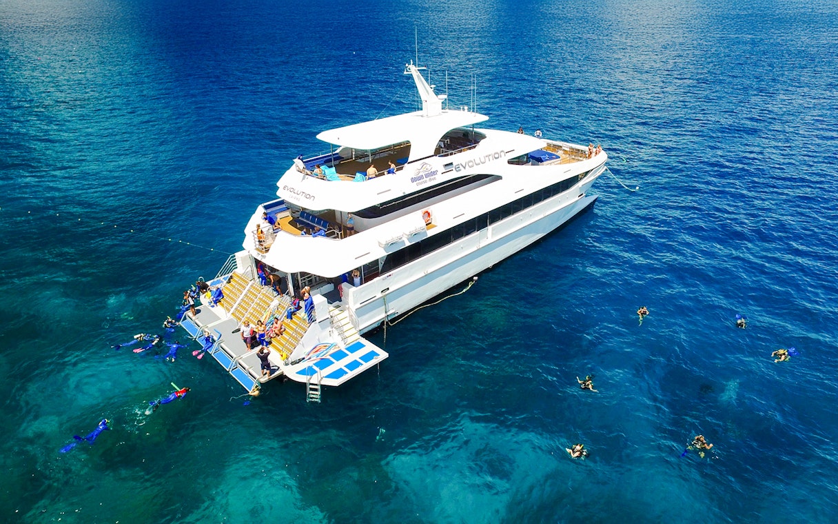 Cruise ship with snorkelers near Great Barrier Reef, Australia.